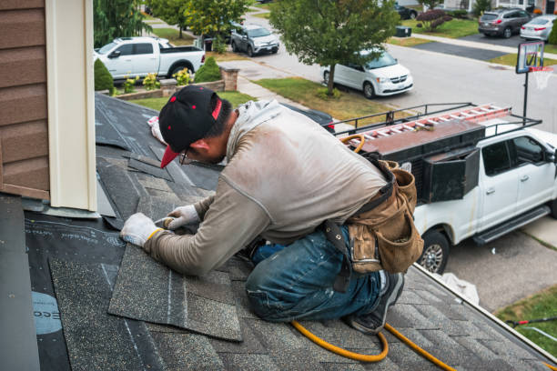 Professional Roofing technician working in Caledonia, MI